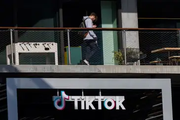 A person arrives at the offices of Tik Tok after the U.S. House of Representatives overwhelmingly passed a bill that would give TikTok's Chinese owner ByteDance about six months to divest the U.S. assets of the short-video app or face a ban, in Culver City, California, U.S., March 13, 2024.  REUTERS/Mike Blake